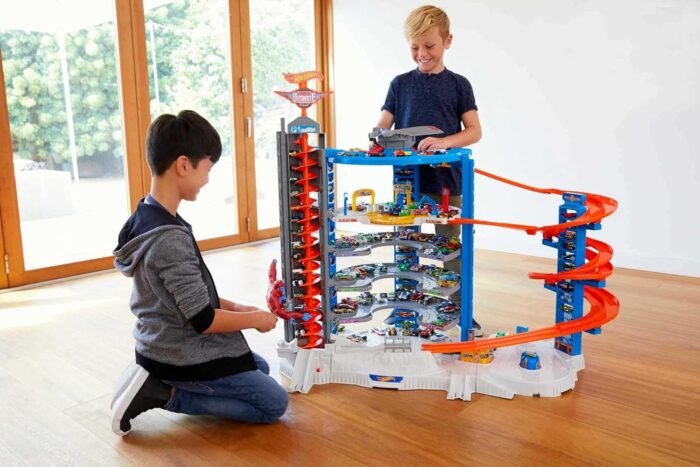 Hot Wheels Toy Car Track Set & 4 1:64 Scale Cars, Super Ultimate Garage, 3+ ft Tall with Motorized Gorilla & Storage for 140 Cars (Amazon Exclusive) - Image 2