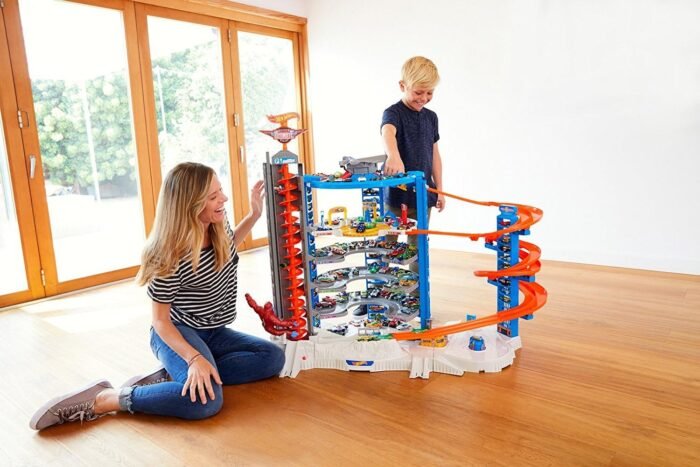 Hot Wheels Toy Car Track Set & 4 1:64 Scale Cars, Super Ultimate Garage, 3+ ft Tall with Motorized Gorilla & Storage for 140 Cars (Amazon Exclusive) - Image 11